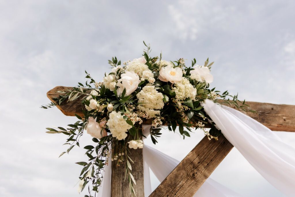 white flowers with green accents