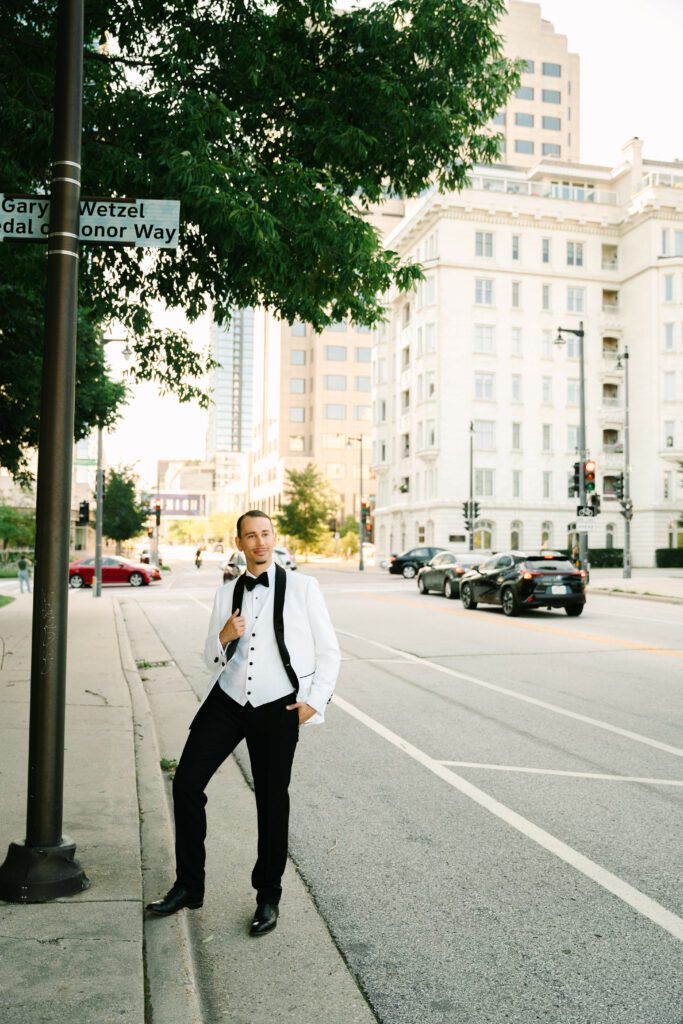 smiling groom posing