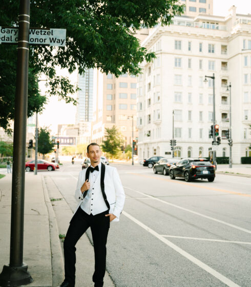 smiling groom posing