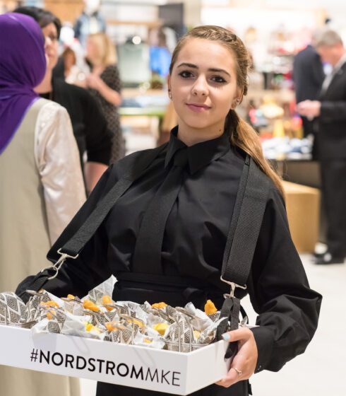 staff carrying box of food