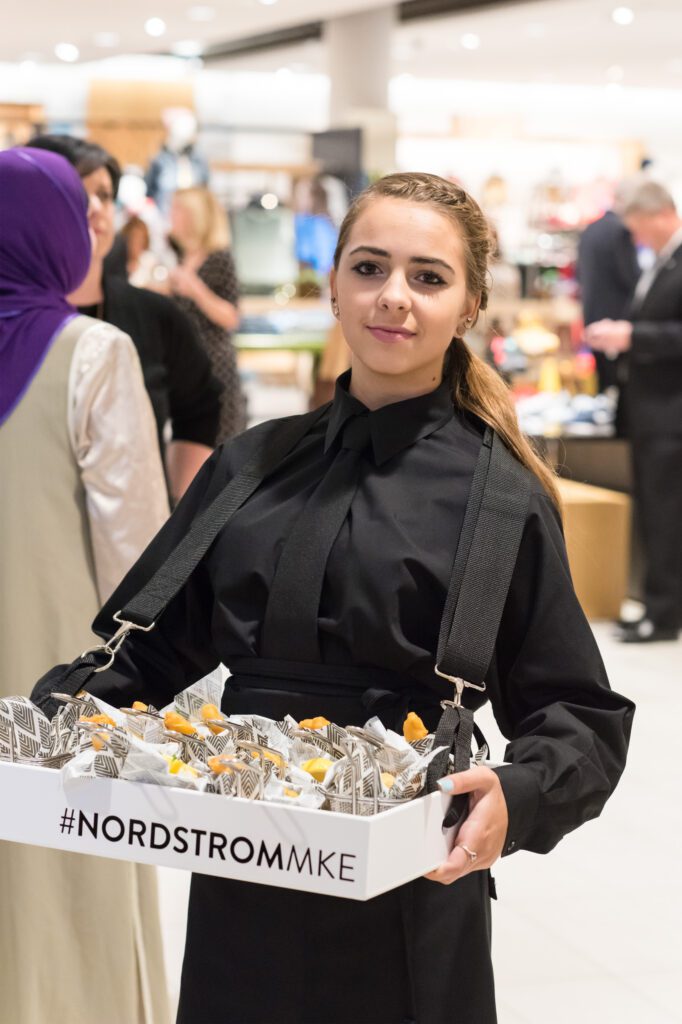staff carrying box of food