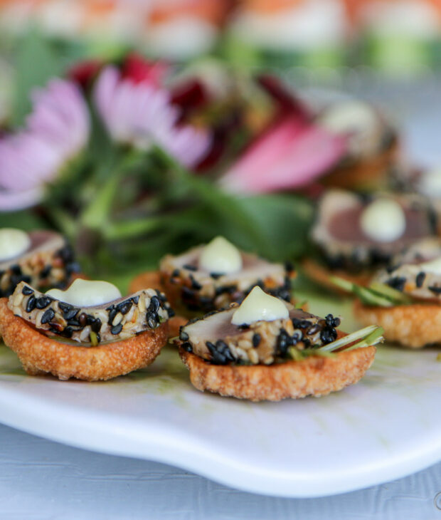 sesame ahi tuna appetizer on white tray