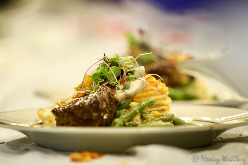 steak and vegetables served on white plate