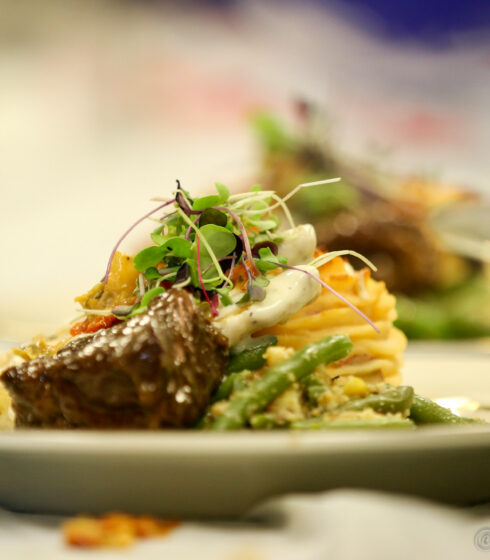 steak and vegetables served on white plate