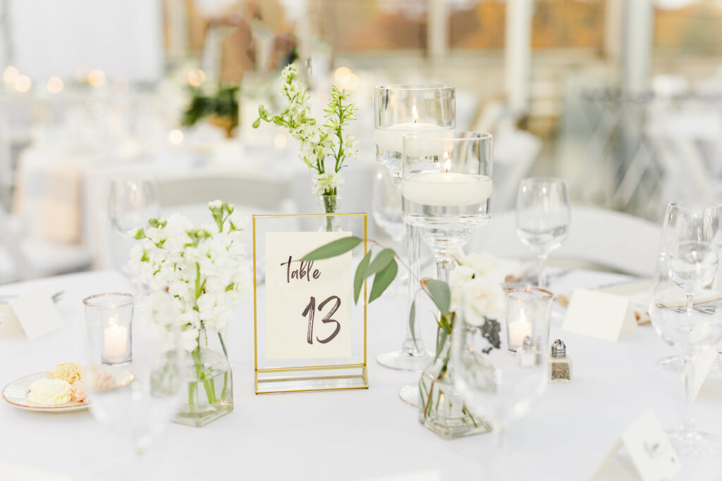 Close up on table with flowers and table number.