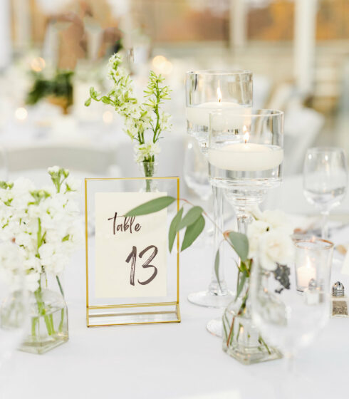 Close up on table with flowers and table number.