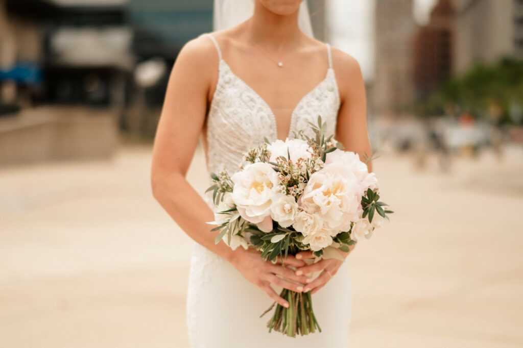 bride with white bouquet