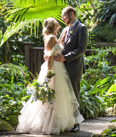 Bride and groom in indoor garden